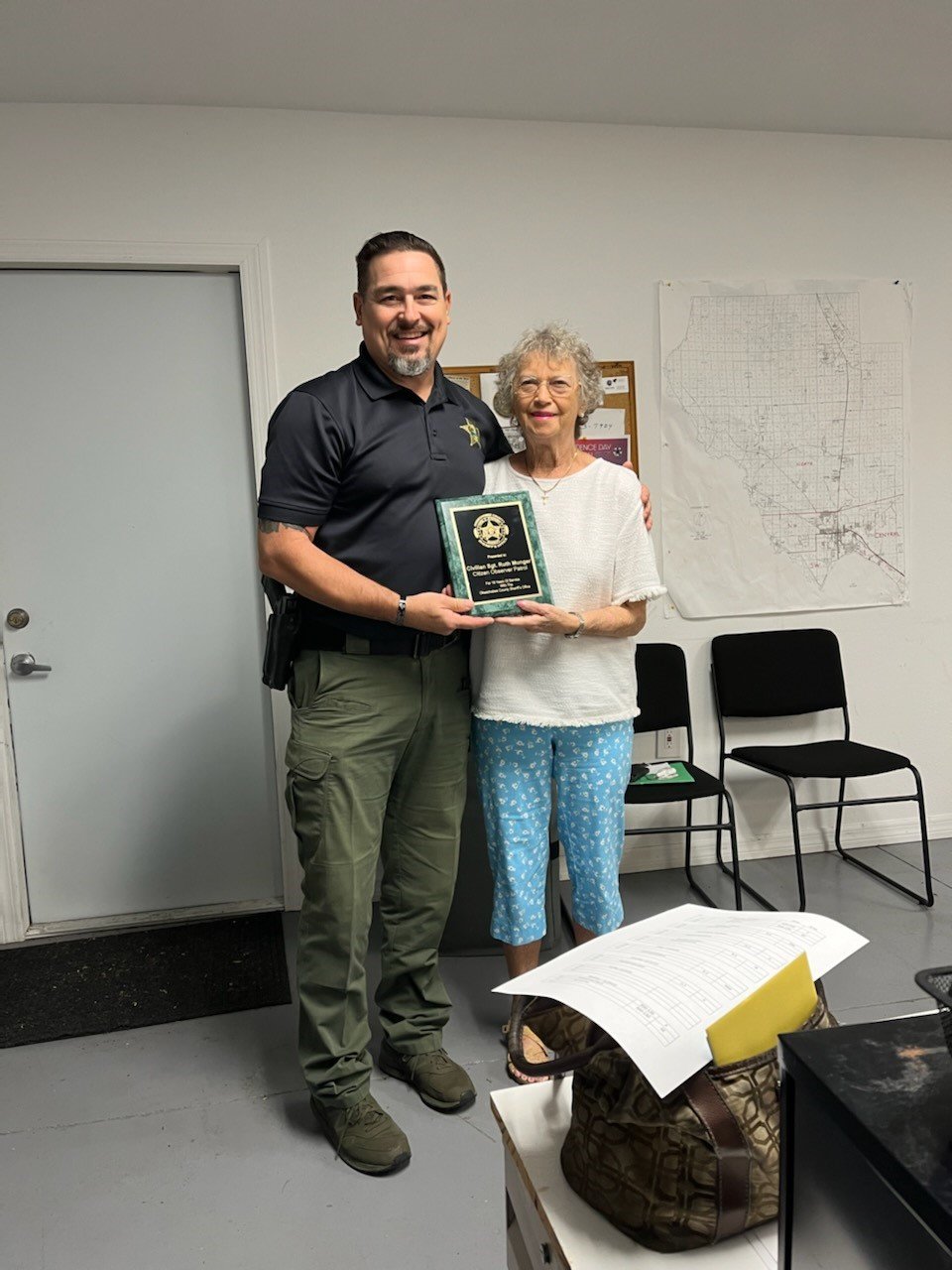 . During Sgt. Ruth Munger's  final meeting, the Sheriff's liaison, Corporal Jack Nash, presented her with a longevity appreciation plaque on behalf of us here and the Sheriff's Office.